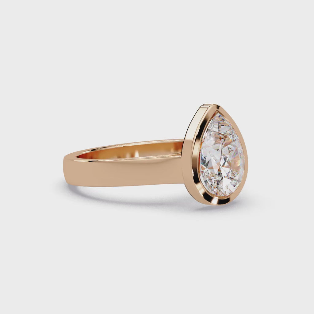 Modern Bezel Set Pear Cut Diamond Ring