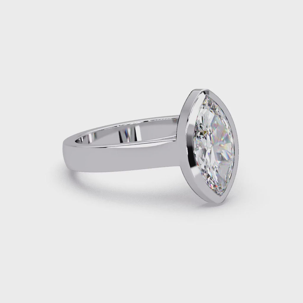 Modern Bezel Set Marquise Cut Diamond Rin