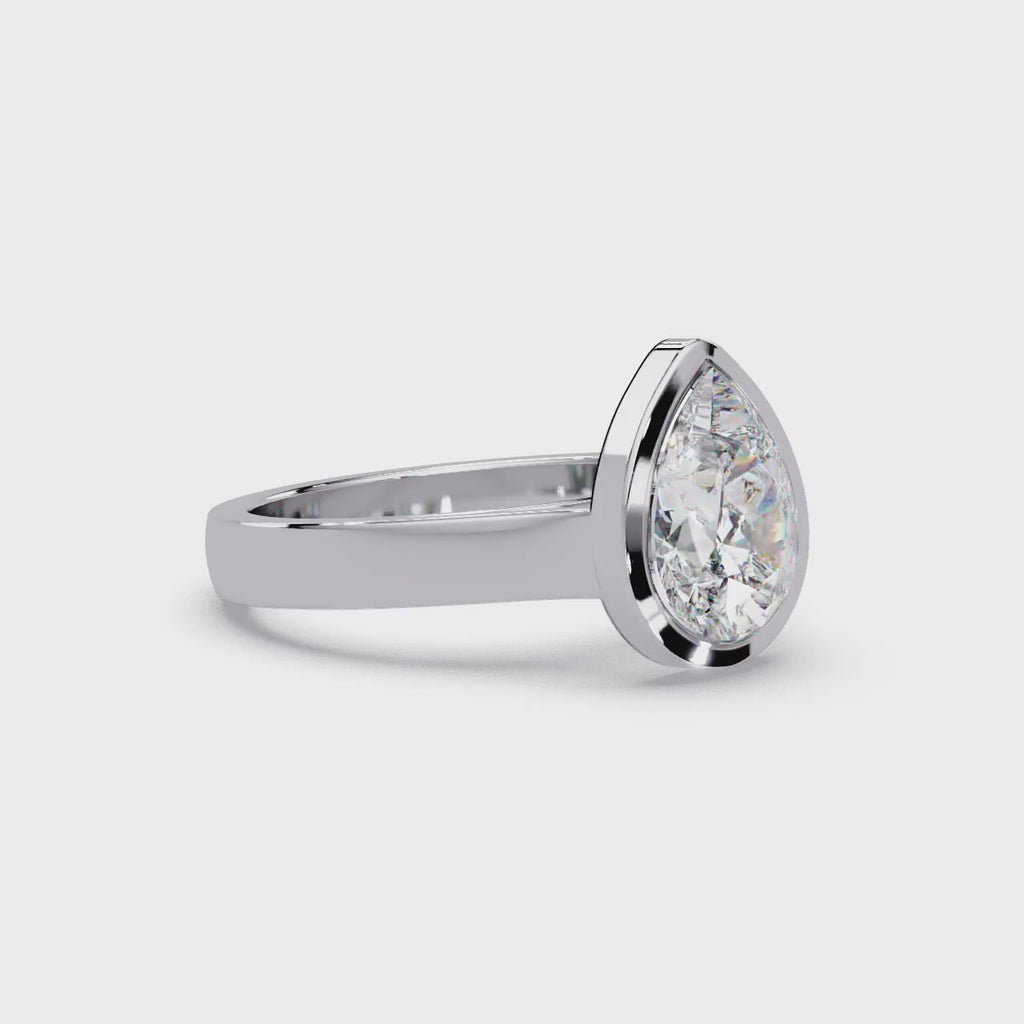 Modern Bezel Set Pear Cut Diamond Ring